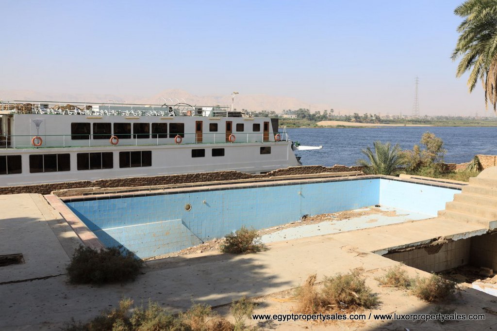 EB2149S The unfinished hotel for sale in East Bank of Luxor Karnak area with Nile view and it is looking to West Bank of Luxor