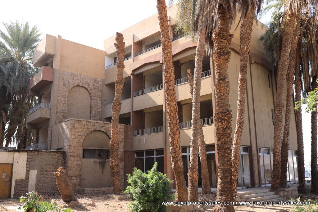 EB2149S The unfinished hotel for sale in East Bank of Luxor Karnak area with Nile view and it is looking to West Bank of Luxor